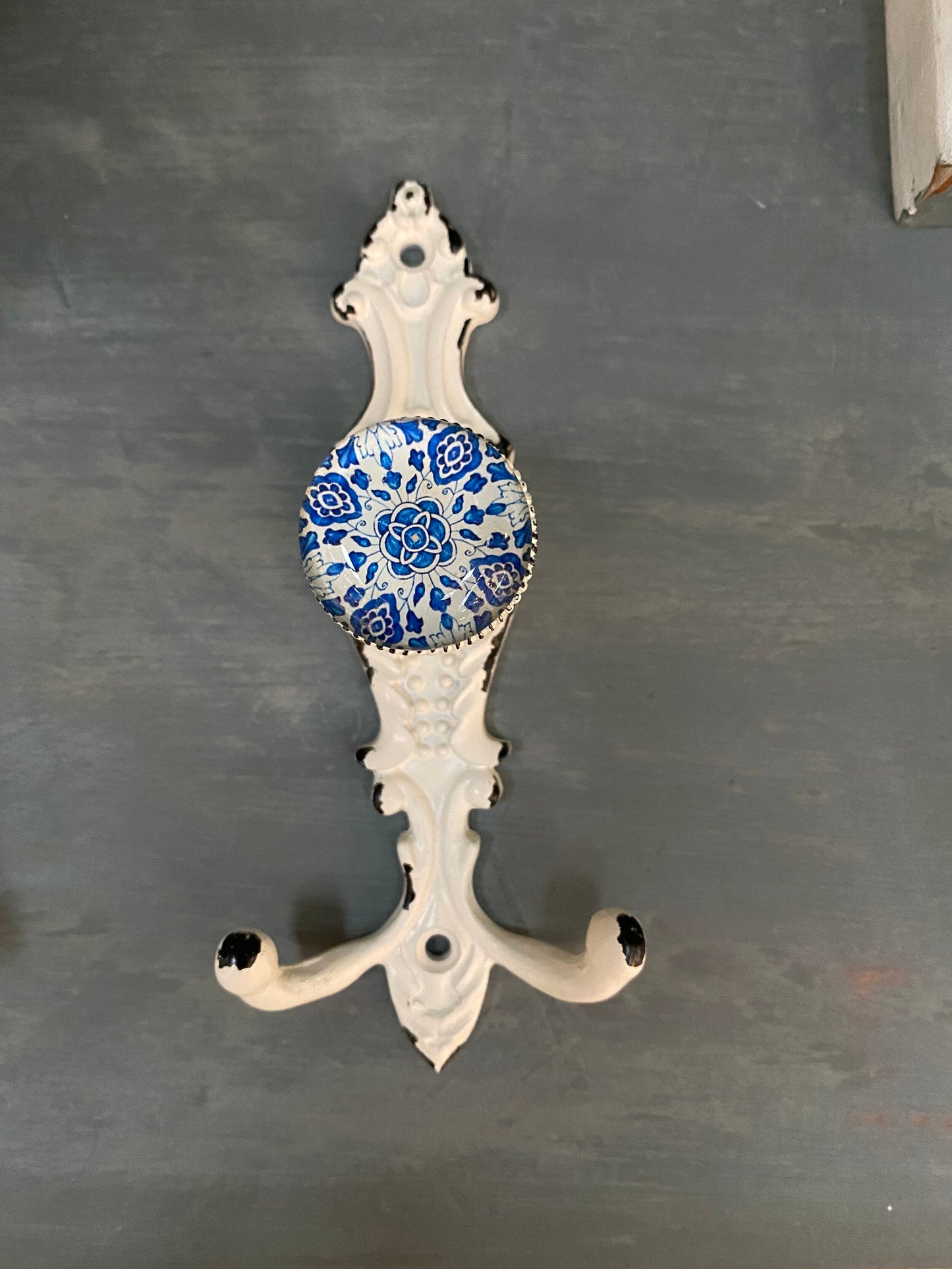 Wall hook with blue glass knob